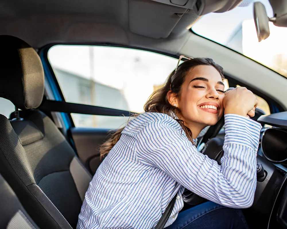 woman smiling in car