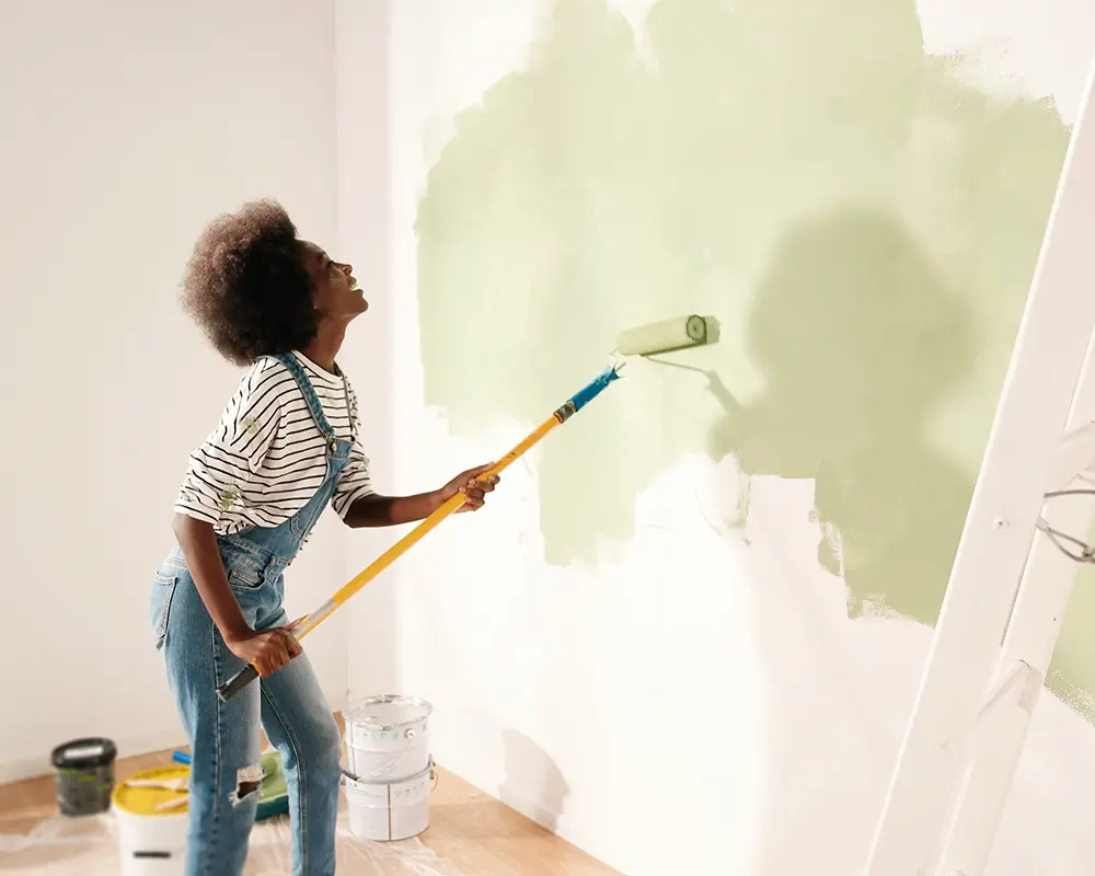 woman painting wall
